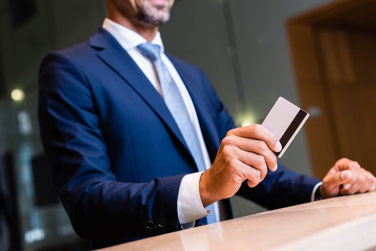 businessman paying with card